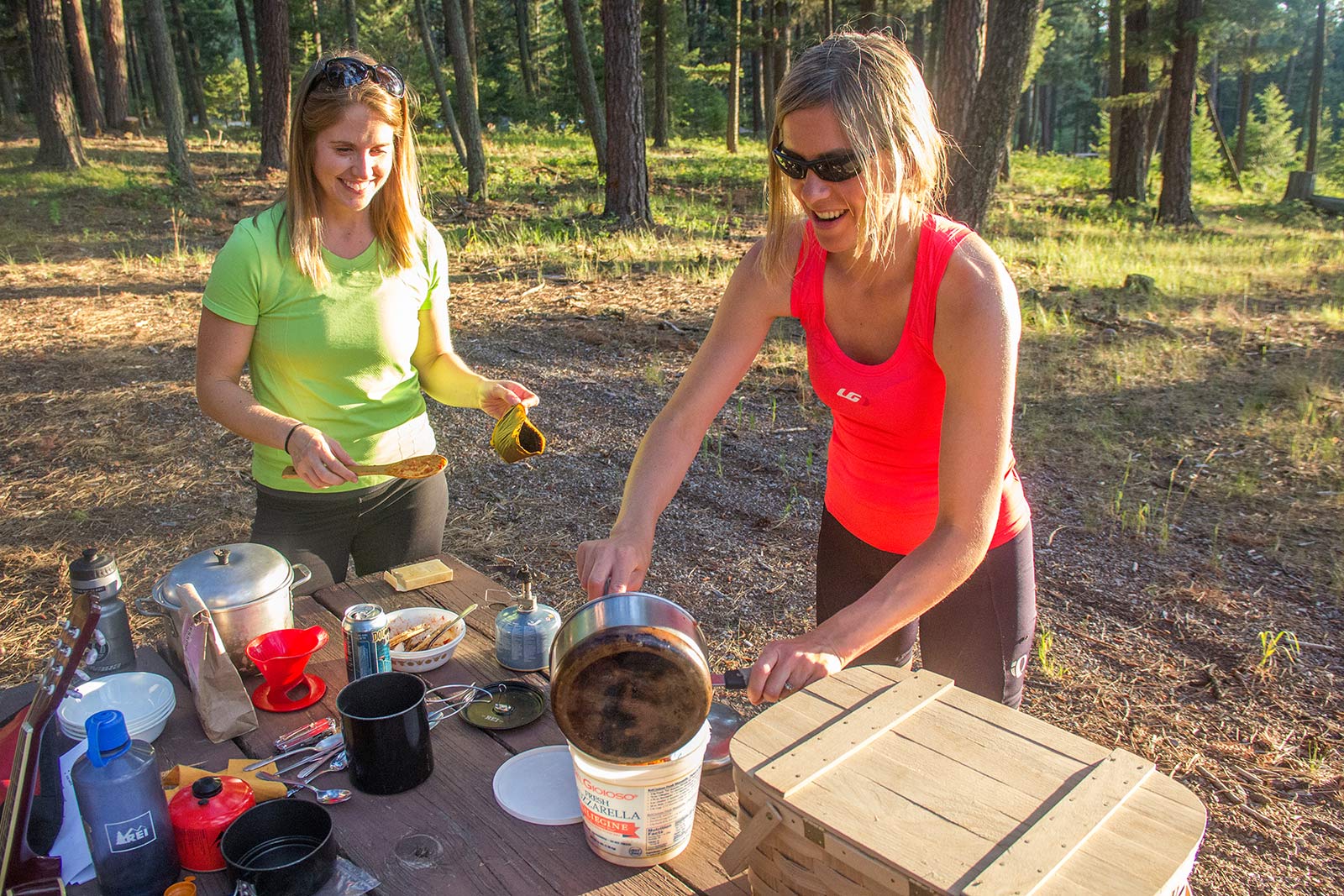 Cyclists cook up some food after a day of biking the Bitterroot Trail